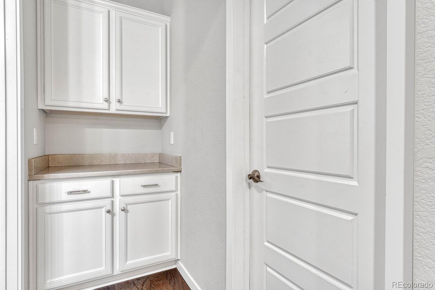 8338 Rivulet Point Highlands Ranch, CO 80129 - Photo 22 of 46 a view of white cabinets