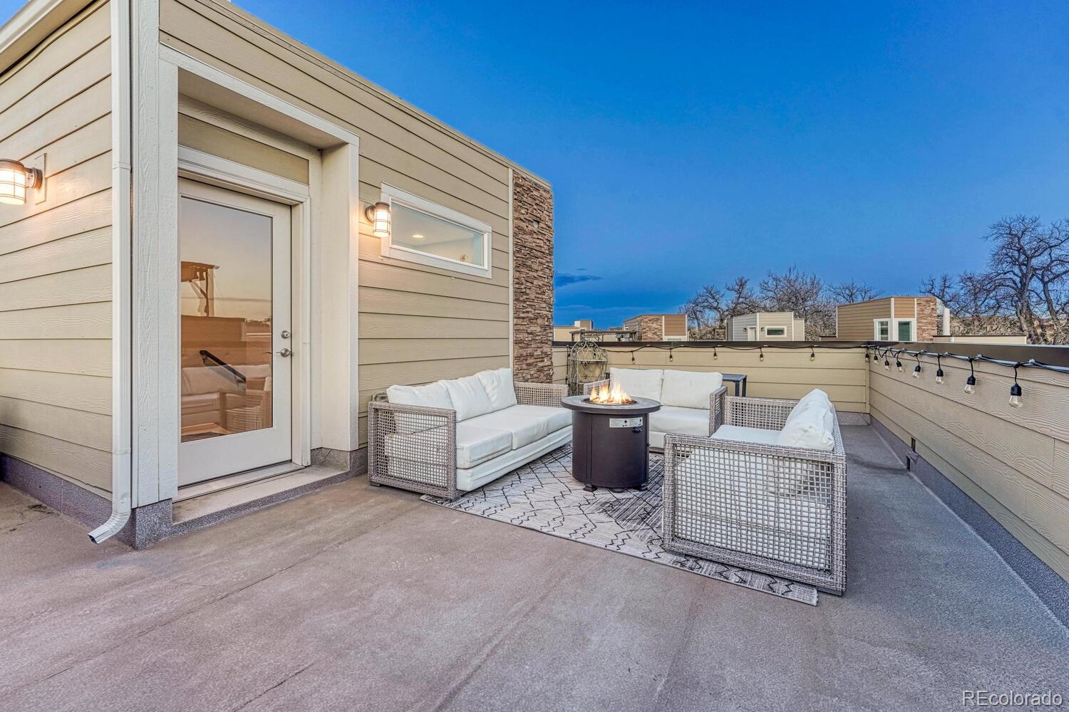 8338 Rivulet Point Highlands Ranch, CO 80129 - Photo 39 of 46 a view of a terrace with couches and sky view