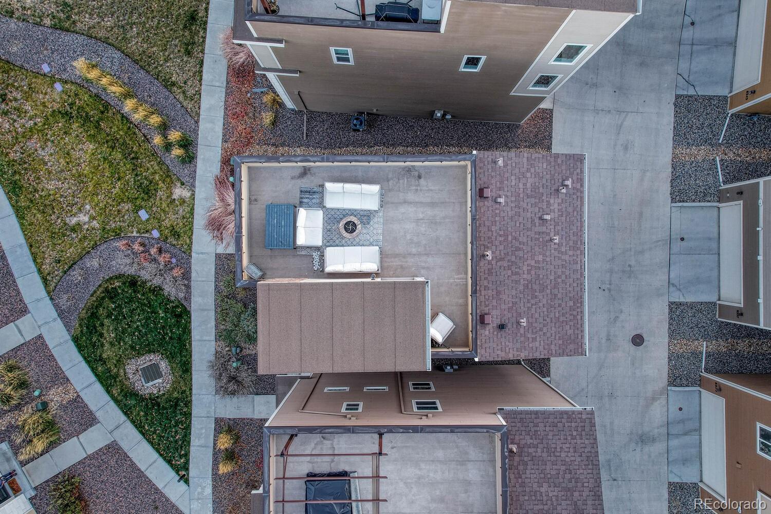 8338 Rivulet Point Highlands Ranch, CO 80129 - Photo 4 of 46 an aerial view of a house with couches and wooden floor