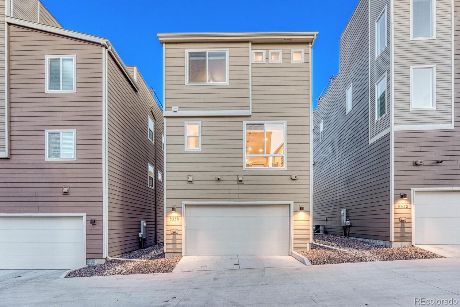 8338 Rivulet Point Highlands Ranch, CO 80129 - Photo 42 of 46 a view of a house with a garage