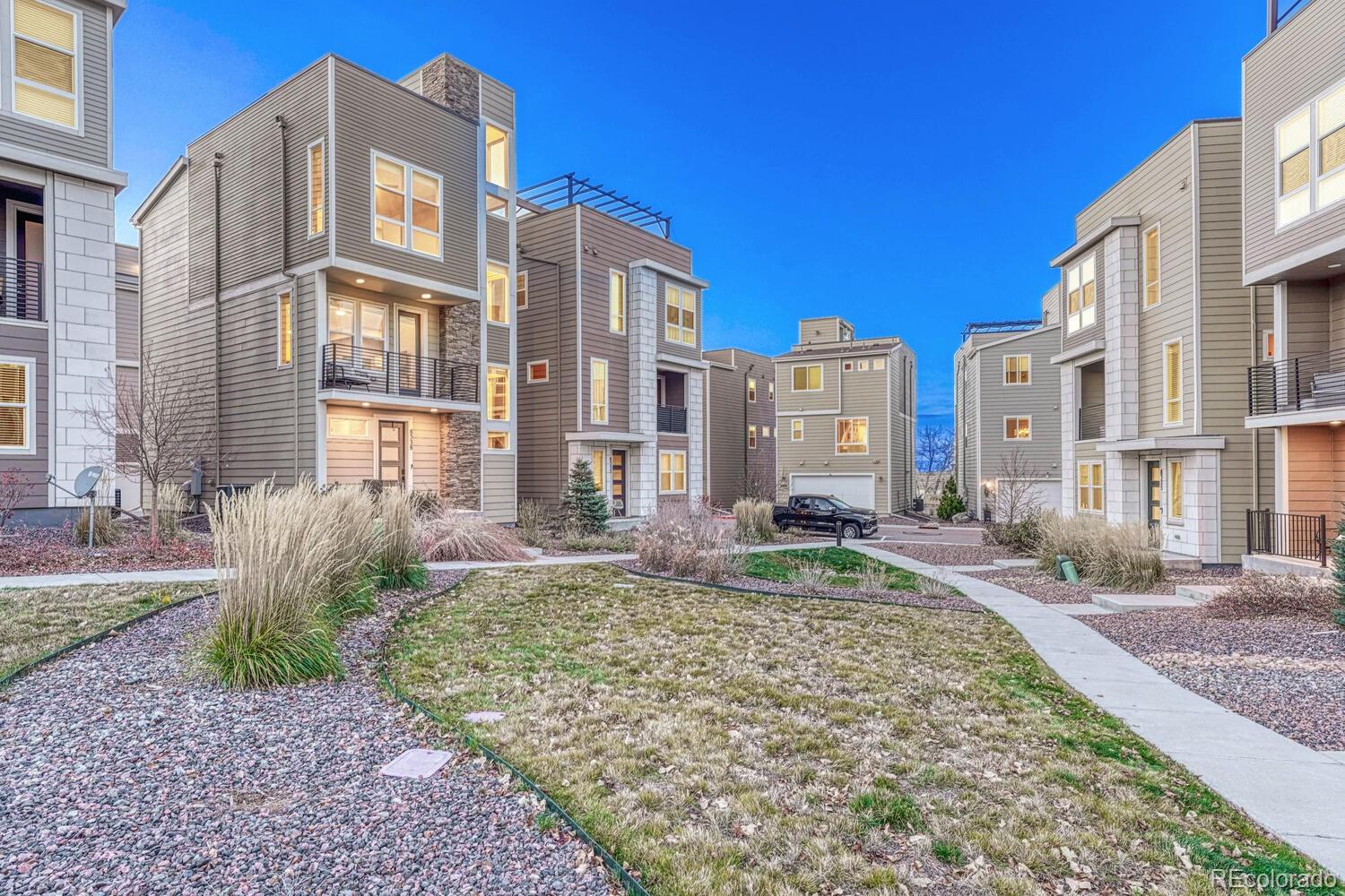 8338 Rivulet Point Highlands Ranch, CO 80129 - Photo 45 of 46 a view of a building with a yard