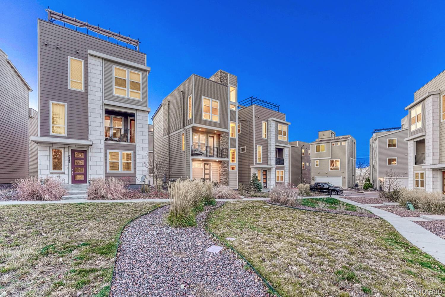 8338 Rivulet Point Highlands Ranch, CO 80129 - Photo 5 of 46 a front view of a house with a yard