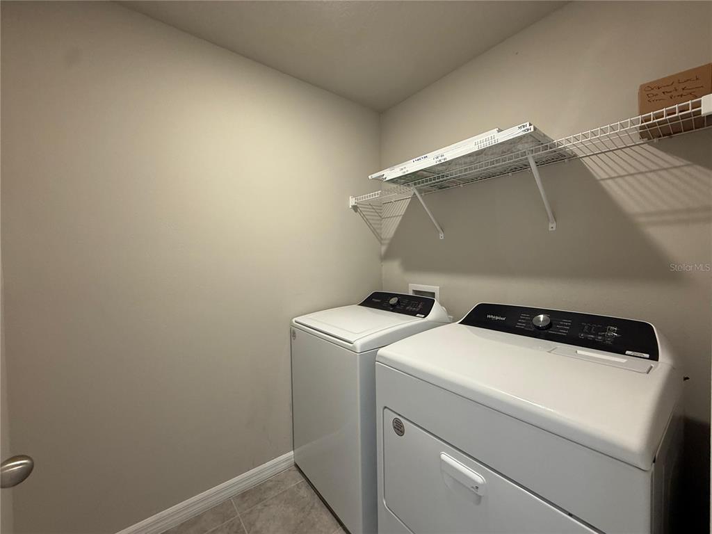 7649 Intrepid Road Wesley Chapel, FL 33545 - Photo 15 of 46 a utility room with dryer and washer