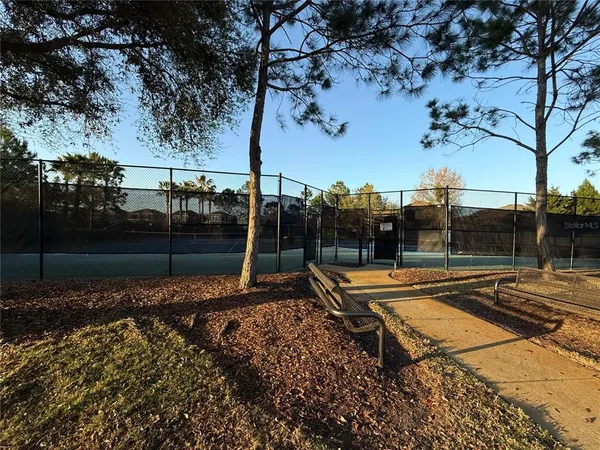 a view of a backyard with sitting area