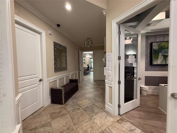 a view of a hallway with wooden shelves