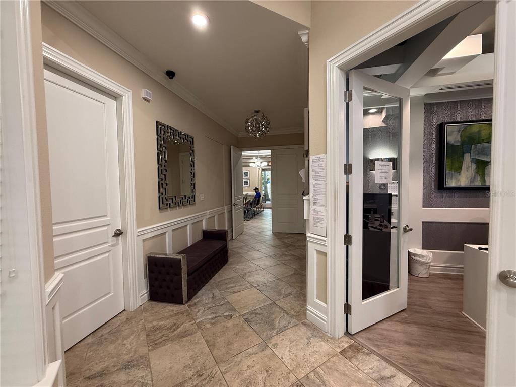 7649 Intrepid Road Wesley Chapel, FL 33545 - Photo 33 of 46 a view of a hallway with wooden shelves