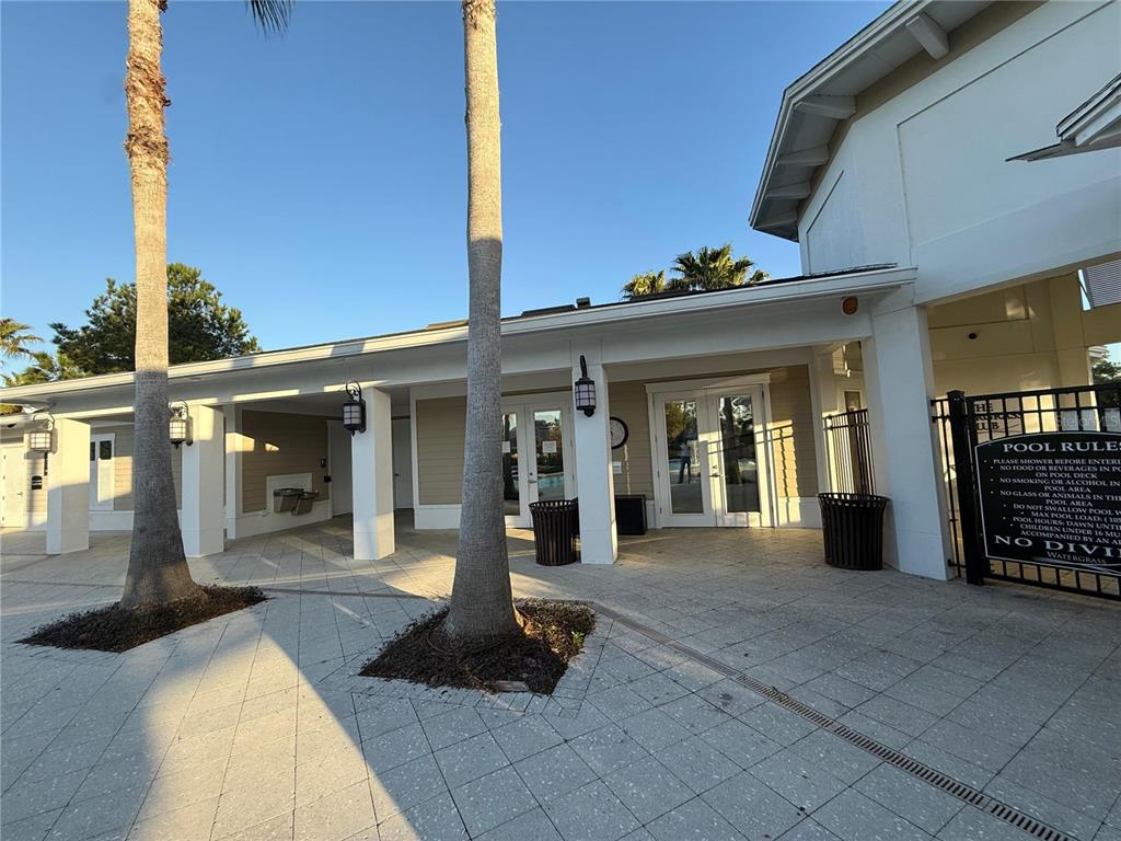 7649 Intrepid Road Wesley Chapel, FL 33545 - Photo 39 of 46 a front view of a building with glass windows