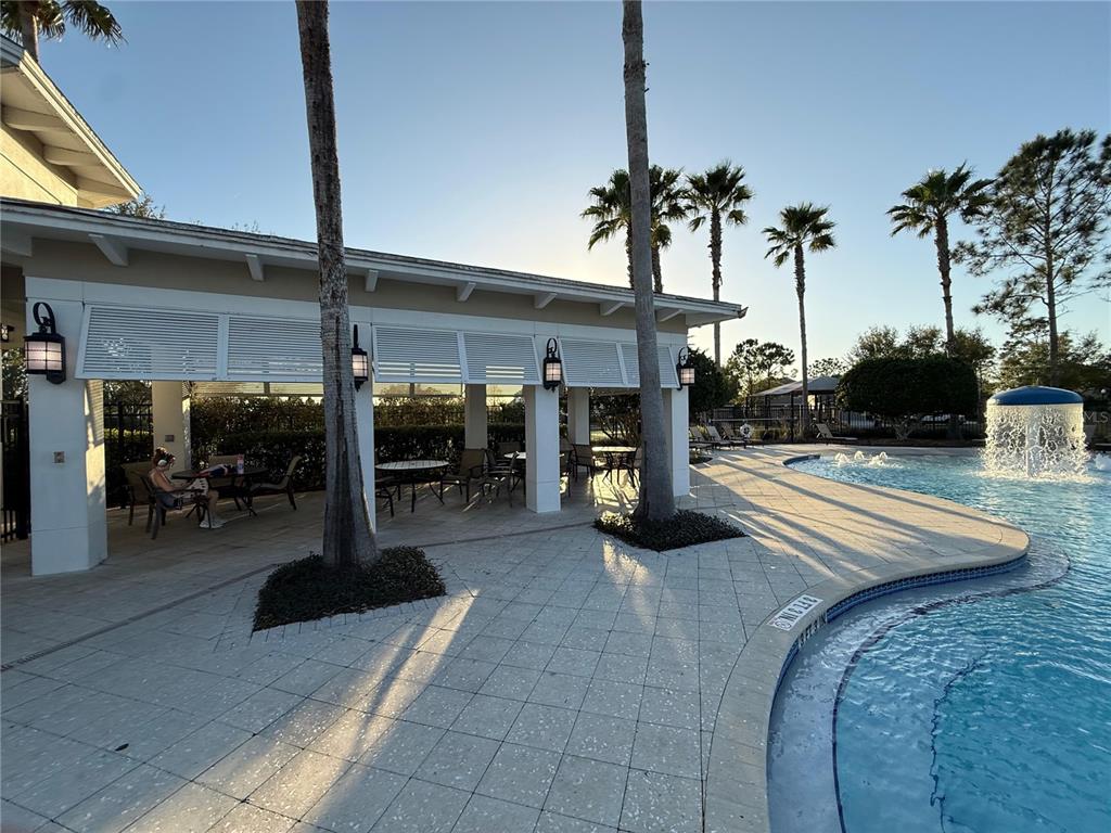 7649 Intrepid Road Wesley Chapel, FL 33545 - Photo 43 of 46 a view of living room with patio furniture and potted plants