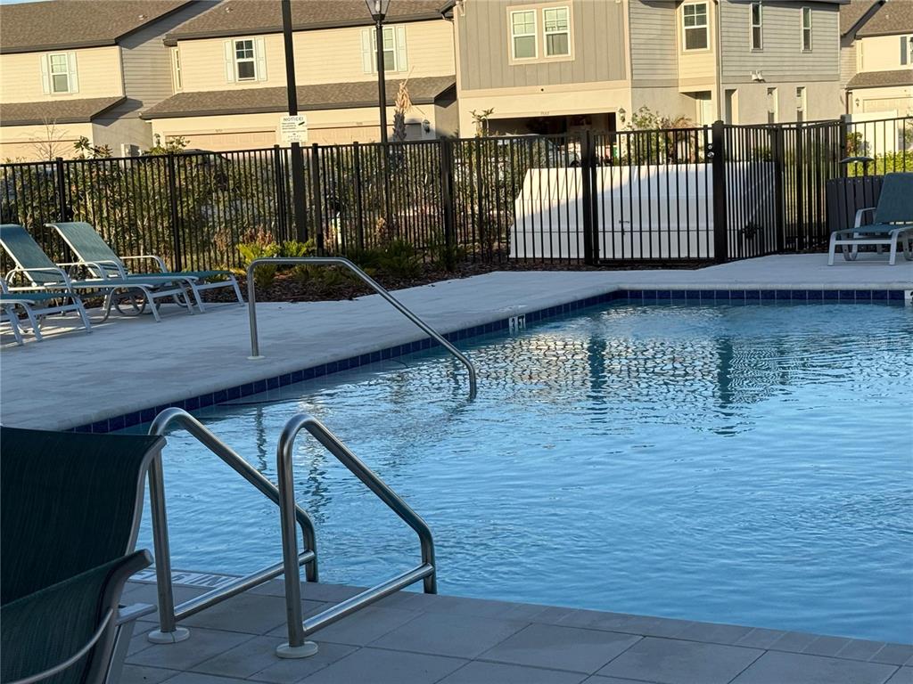 7649 Intrepid Road Wesley Chapel, FL 33545 - Photo 44 of 46 a view of a balcony with two chairs and a table