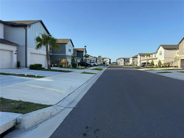 a view of a street with houses