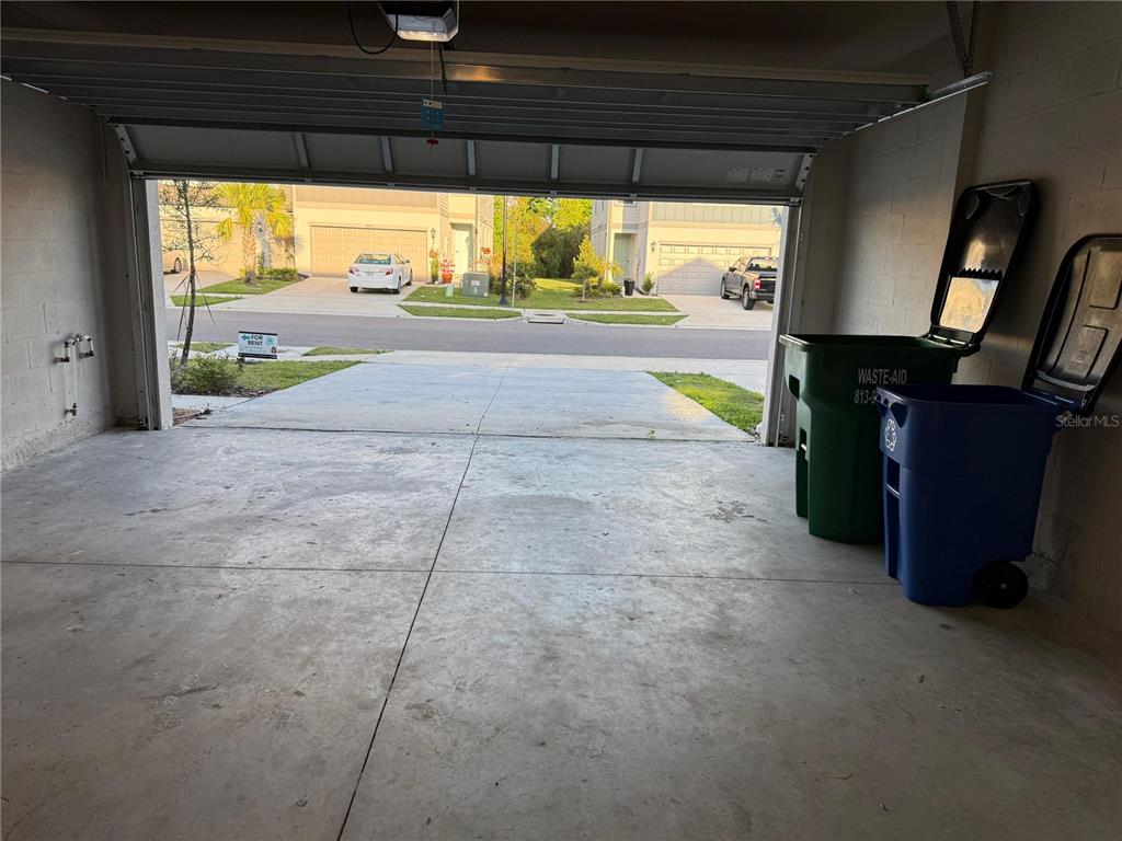 7649 Intrepid Road Wesley Chapel, FL 33545 - Photo 7 of 46 a view of empty room with wooden floor and fan