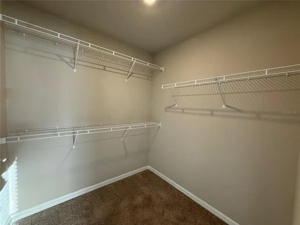 a view of a room with racks on the wall