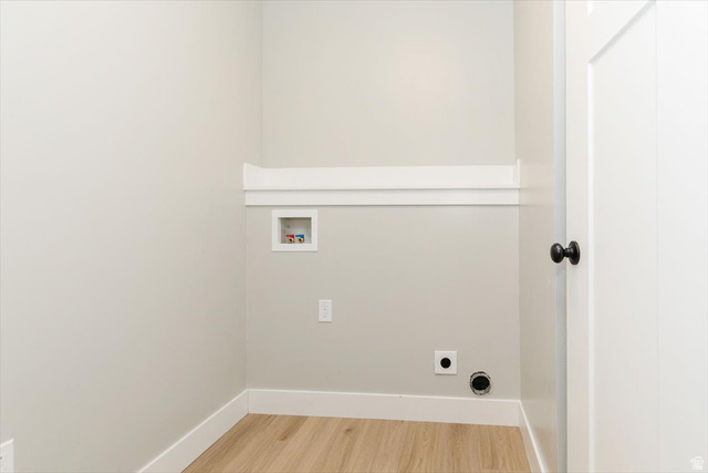 226 South 600 West Logan, UT 84321 - Photo 15 of 25 Laundry area featuring wood finished floors, hookup for a washing machine, and hookup for an electric dryer