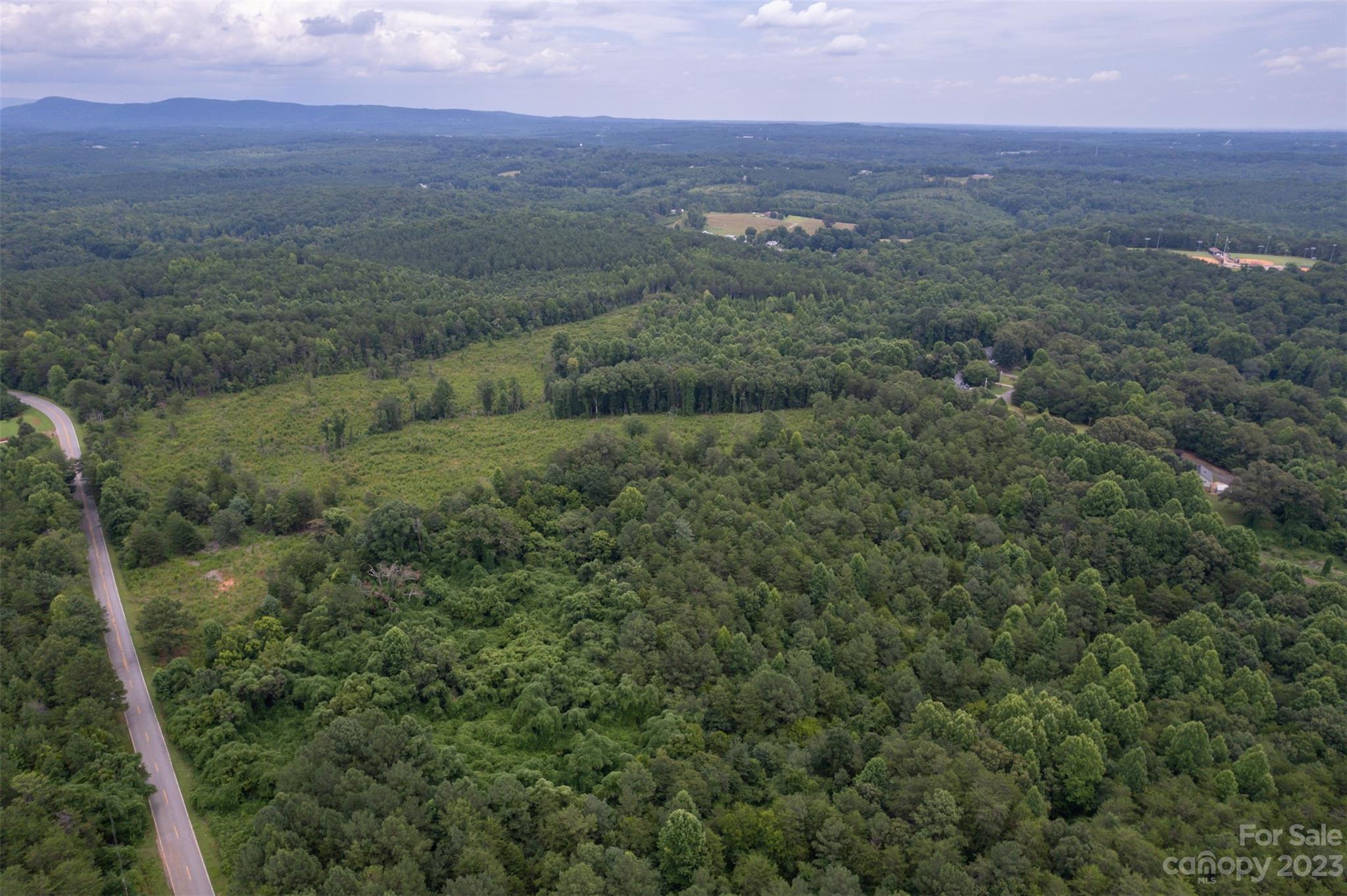 0 Horn Bottom Road Forest City, NC 28043 - Photo 13 of 22 a view of a city with lush green forest