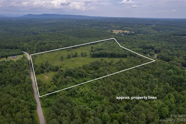 a view of a balcony with a forest