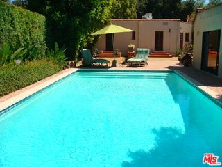 a front view of a house with patio and fire pit