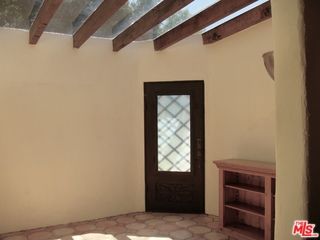 a view of a swimming pool with an outdoor space and seating area
