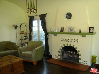 a view of livingroom with furniture and a floor to ceiling window