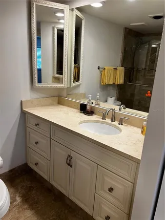 a bathroom with a sink and a mirror