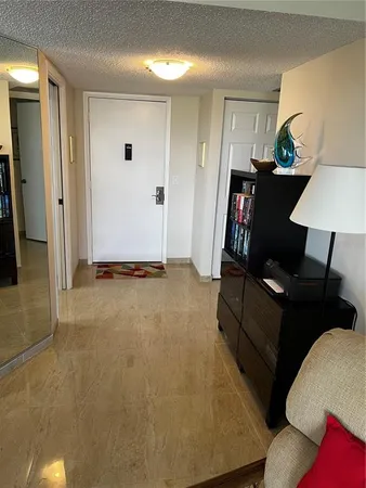a living room with furniture and a lamp