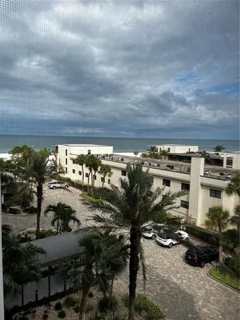 a view of a chairs and table in a backyard