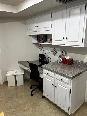 a kitchen with stainless steel appliances granite countertop a sink dishwasher a stove and a cabinets