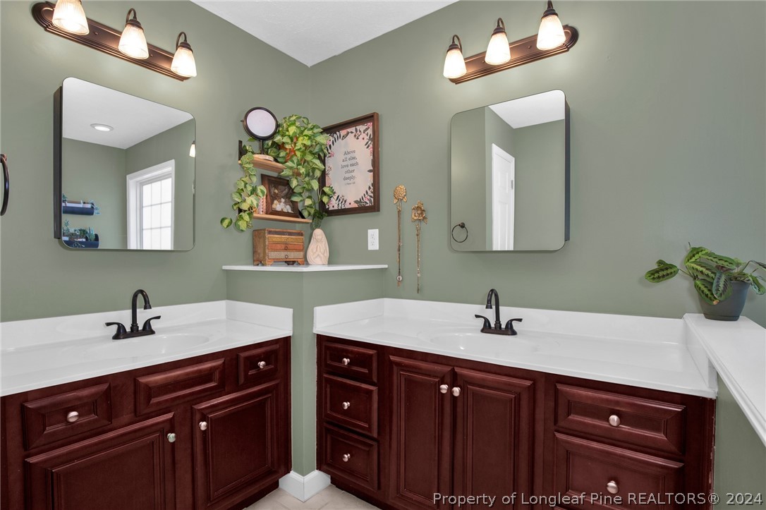 101 Lattimore Road Cameron, NC 28326 - Photo 16 of 33 a bathroom with a sink and a mirror
