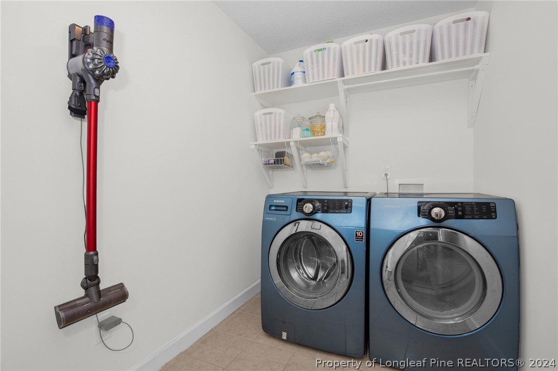 101 Lattimore Road Cameron, NC 28326 - Photo 18 of 33 a utility room with dryer and washer