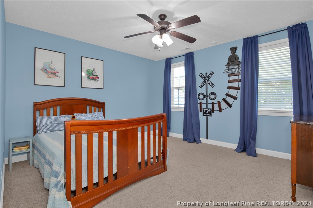 101 Lattimore Road Cameron, NC 28326 - Photo 19 of 33 a bedroom with furniture and window