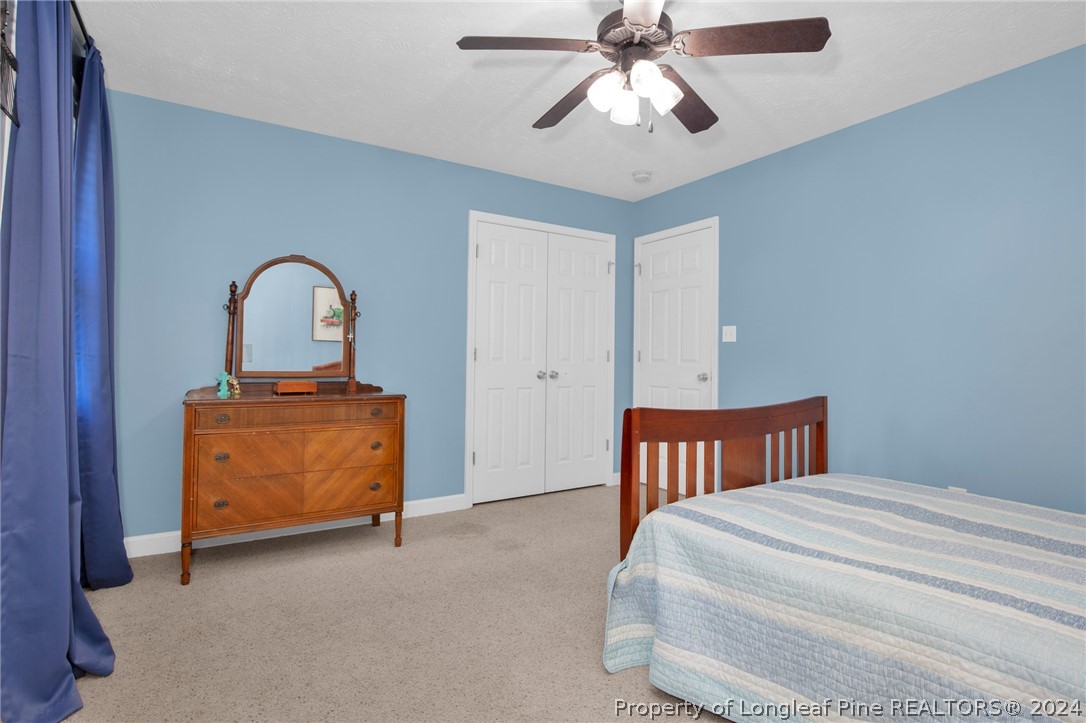 101 Lattimore Road Cameron, NC 28326 - Photo 20 of 33 a bedroom with a bed and a dresser