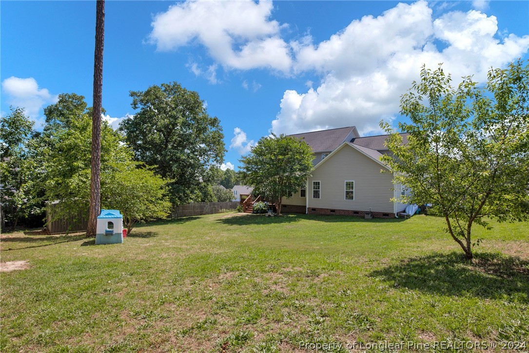 101 Lattimore Road Cameron, NC 28326 - Photo 2 of 33 a view of a tree in front of a house