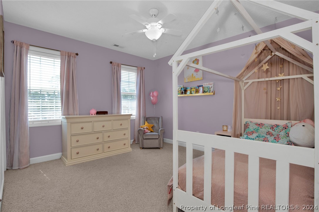 101 Lattimore Road Cameron, NC 28326 - Photo 21 of 33 a bedroom with furniture and a window