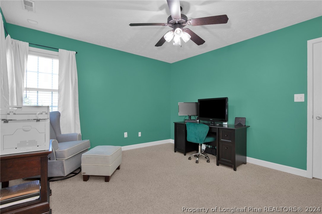 101 Lattimore Road Cameron, NC 28326 - Photo 23 of 33 a view of a livingroom with workspace and a window