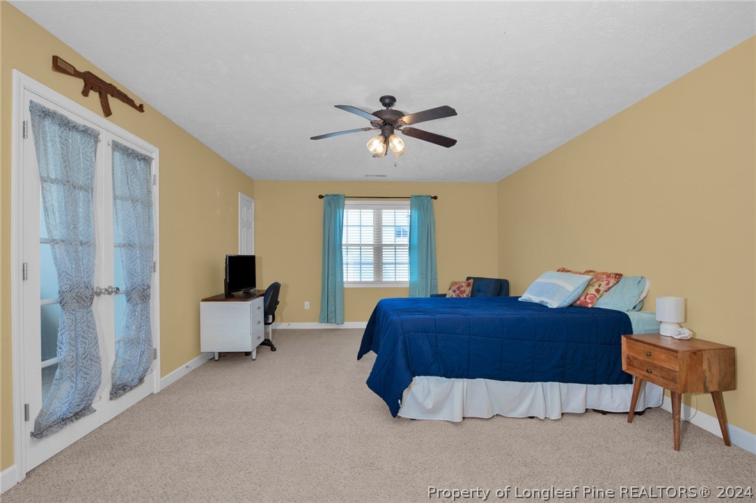 101 Lattimore Road Cameron, NC 28326 - Photo 24 of 33 a bedroom with a bed and window