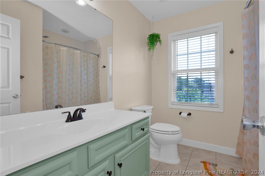 101 Lattimore Road Cameron, NC 28326 - Photo 25 of 33 a bathroom with a sink and a mirror