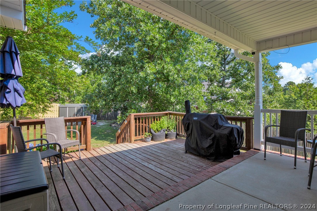 101 Lattimore Road Cameron, NC 28326 - Photo 30 of 33 a balcony with wooden floor table and chairs