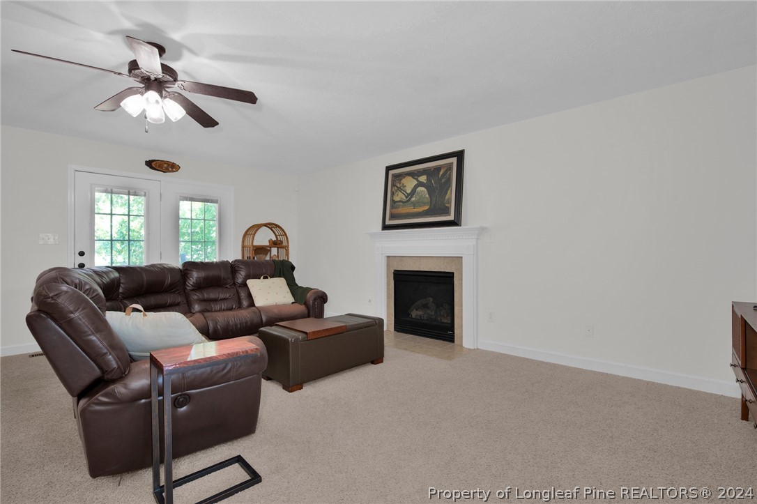 101 Lattimore Road Cameron, NC 28326 - Photo 6 of 33 a living room with furniture and a fireplace