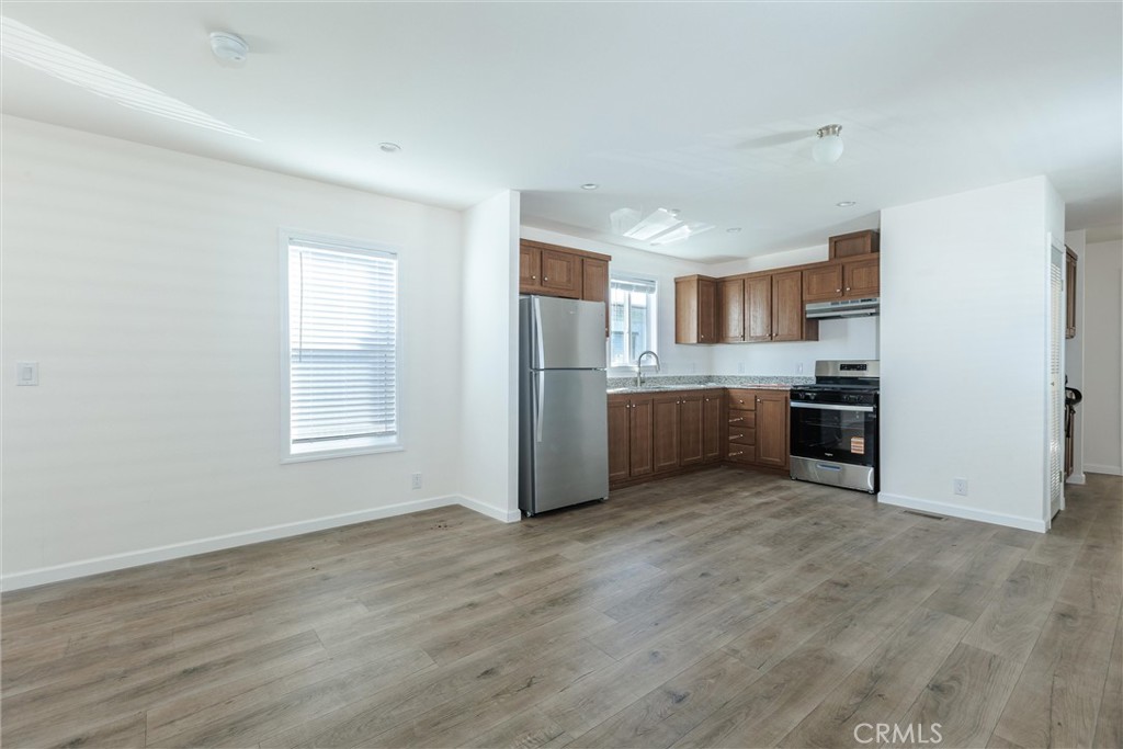 3210 Santa Maria Way, Unit 21 Santa Maria, CA 93455 - Photo 13 of 13 a view of a kitchen with a sink stove cabinets and empty room