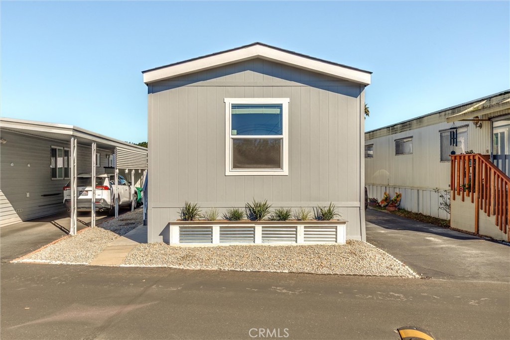 3210 Santa Maria Way, Unit 21 Santa Maria, CA 93455 - Photo 2 of 13 a front view of a house with a yard