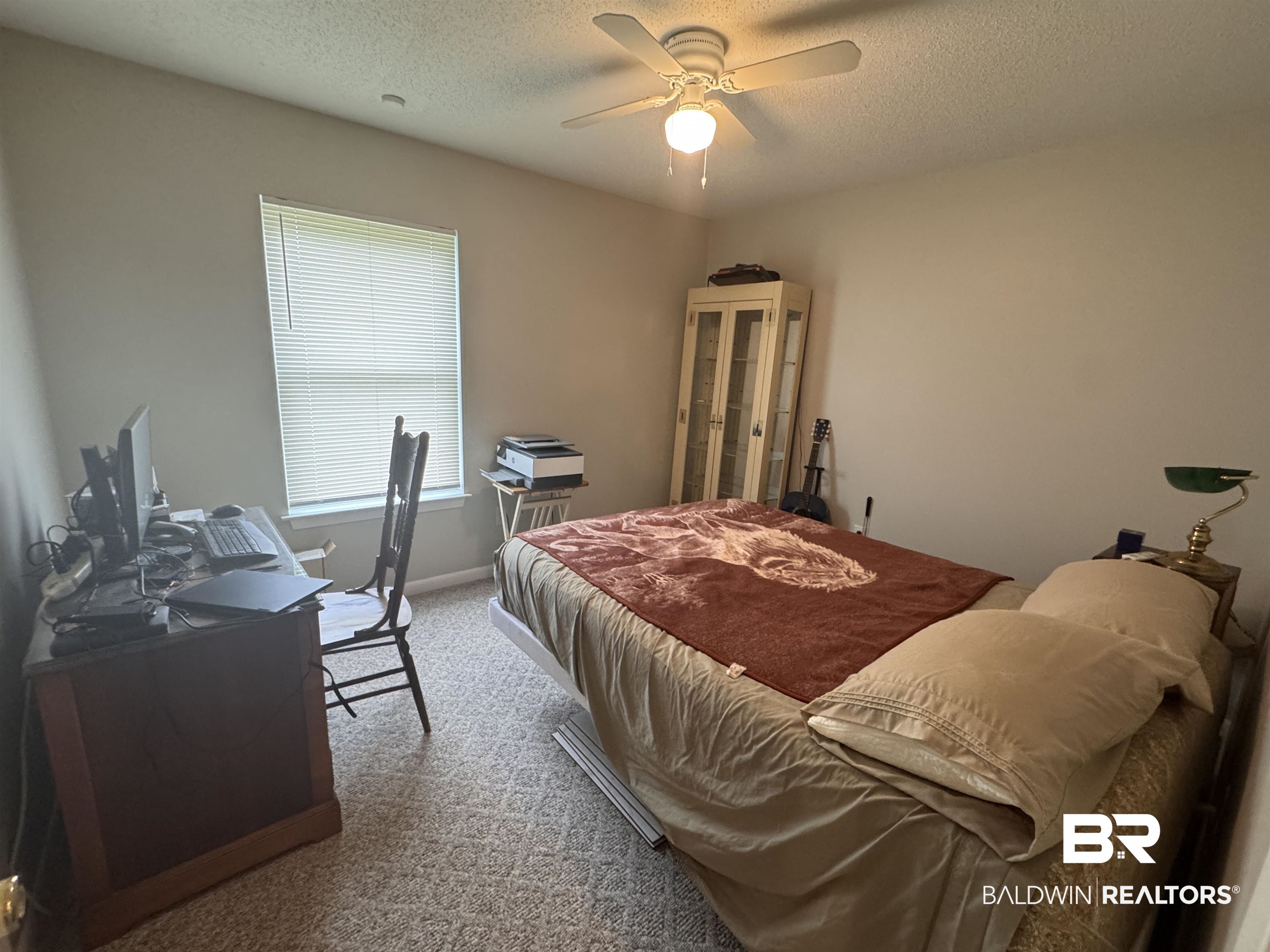 15148 Highland Circle Foley, AL 36535 - Photo 22 of 47 Bedroom with a textured ceiling, carpet flooring, and a ceiling fan