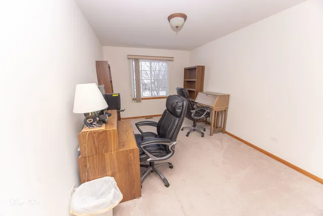 a workspace with furniture and a window