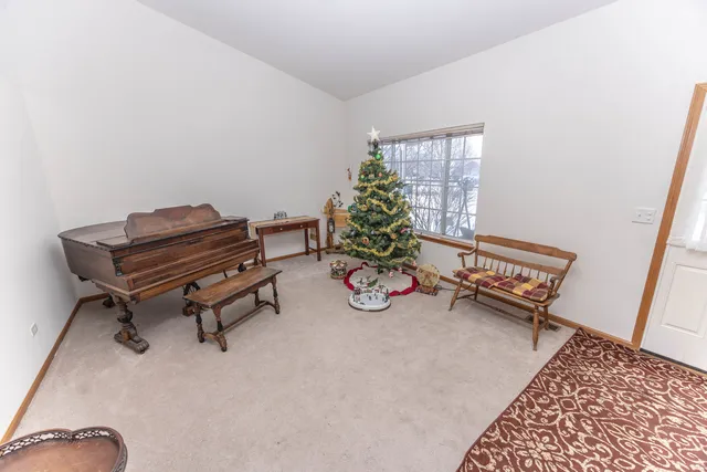 a living room with furniture and a rug