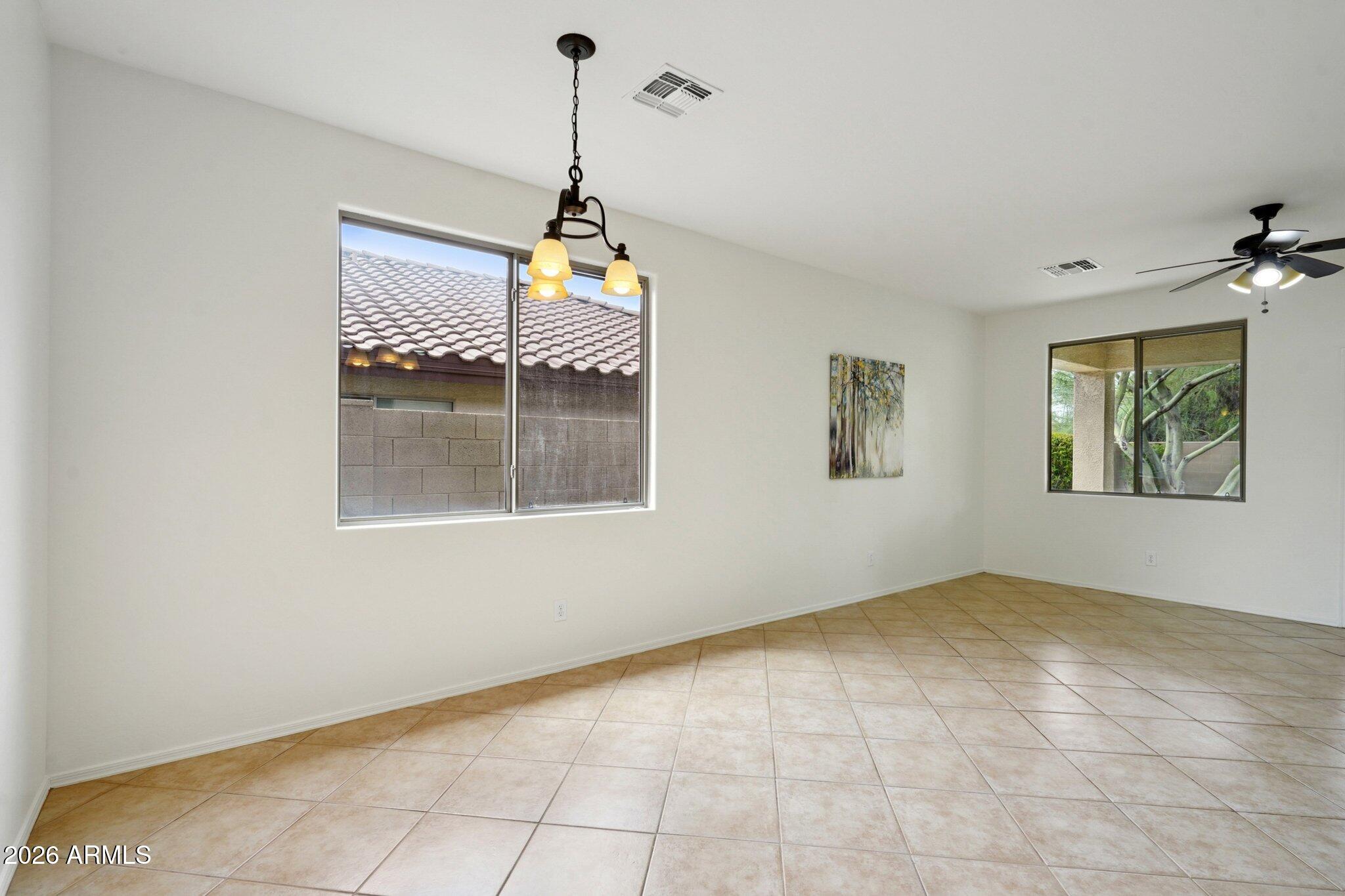 3852 West Ranier Court Anthem, AZ 85086 - Photo 12 of 58 a view of empty room with windows