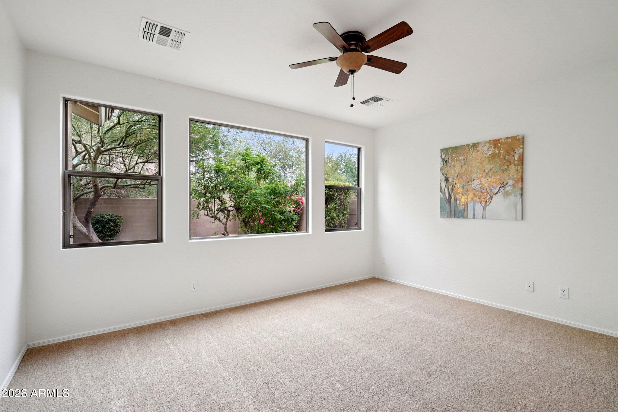 3852 West Ranier Court Anthem, AZ 85086 - Photo 13 of 58 a view of an empty room with a window