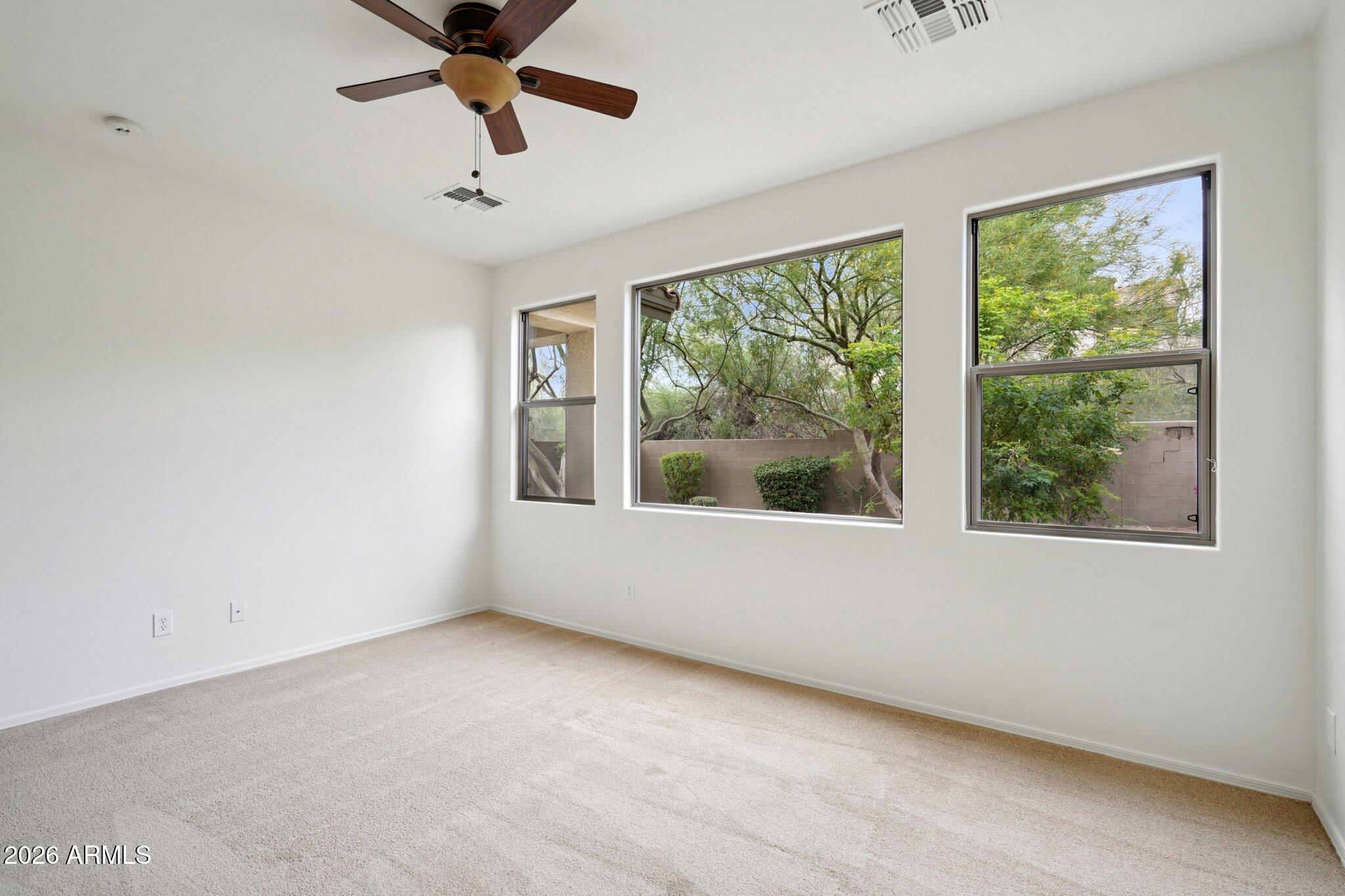 3852 West Ranier Court Anthem, AZ 85086 - Photo 14 of 58 a view of an empty room with a window