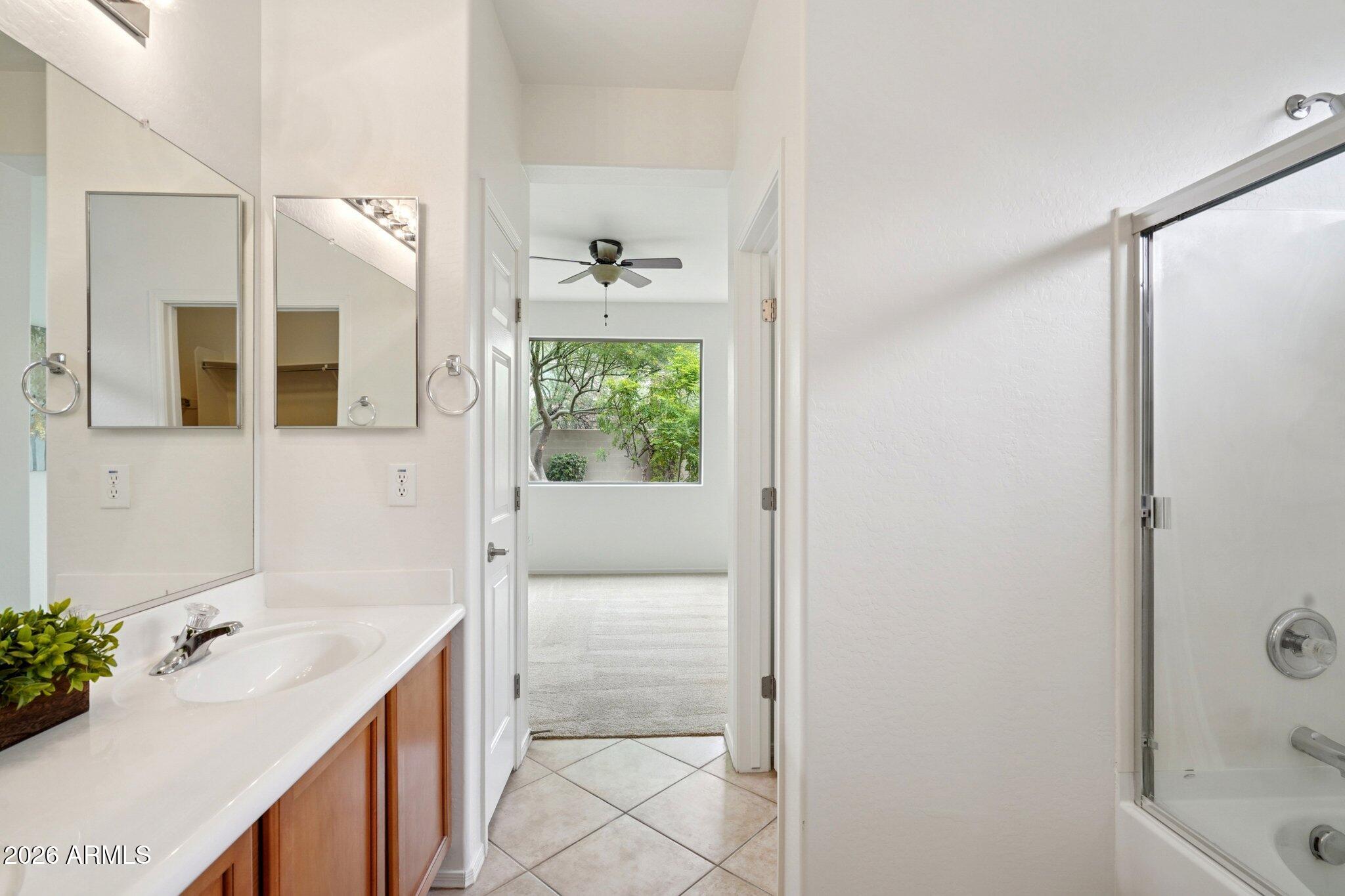 3852 West Ranier Court Anthem, AZ 85086 - Photo 22 of 58 a bathroom with a sink toilet and shower
