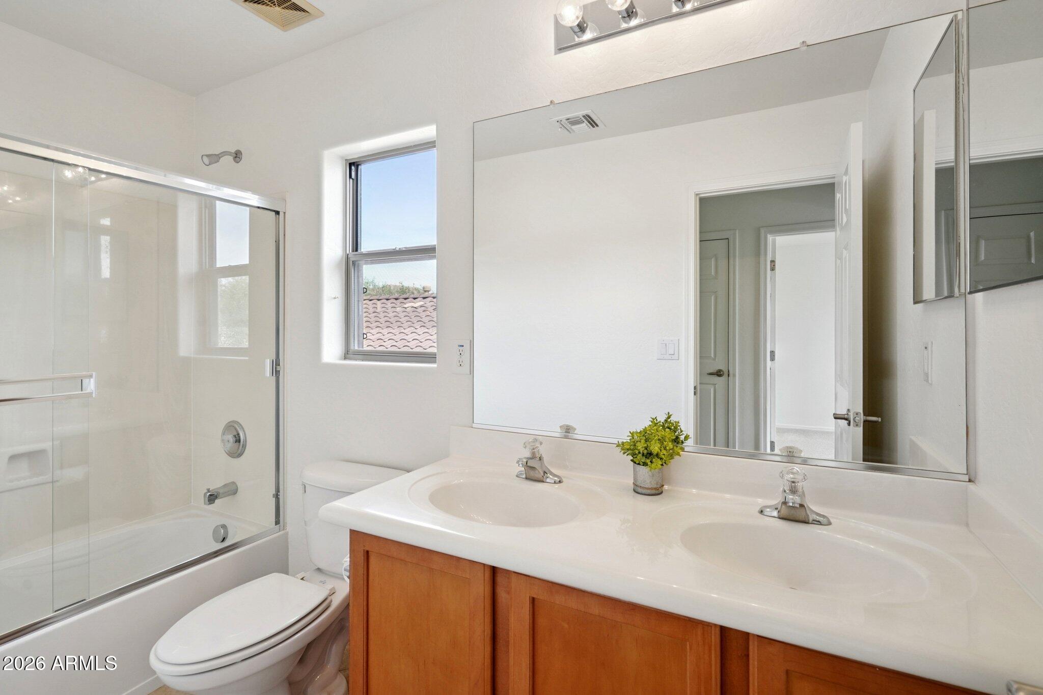 3852 West Ranier Court Anthem, AZ 85086 - Photo 29 of 58 a bathroom with a sink toilet and shower