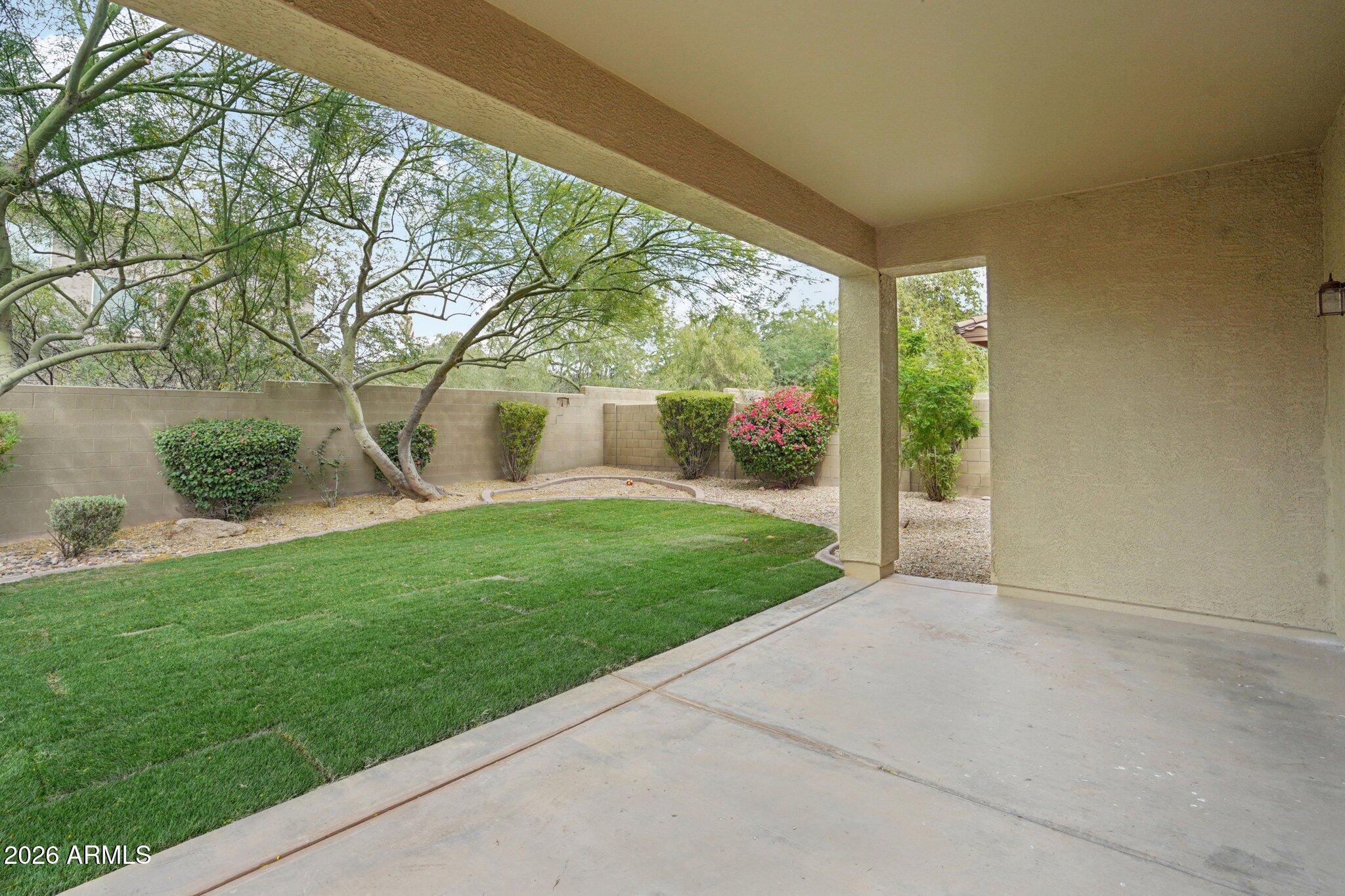 3852 West Ranier Court Anthem, AZ 85086 - Photo 37 of 58 a view of a back yard from a room