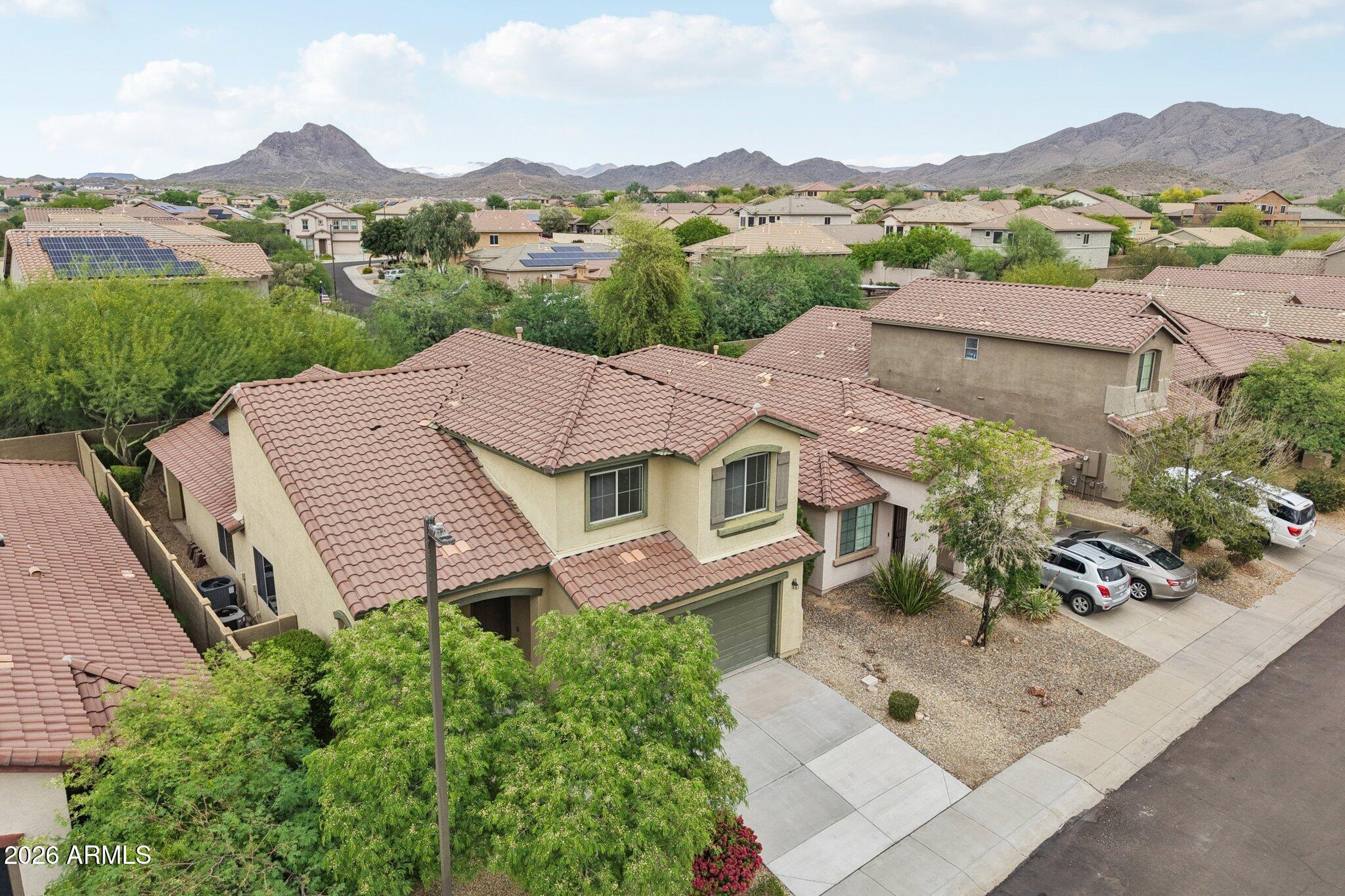 3852 West Ranier Court Anthem, AZ 85086 - Photo 41 of 58 an aerial view of a house with a garden