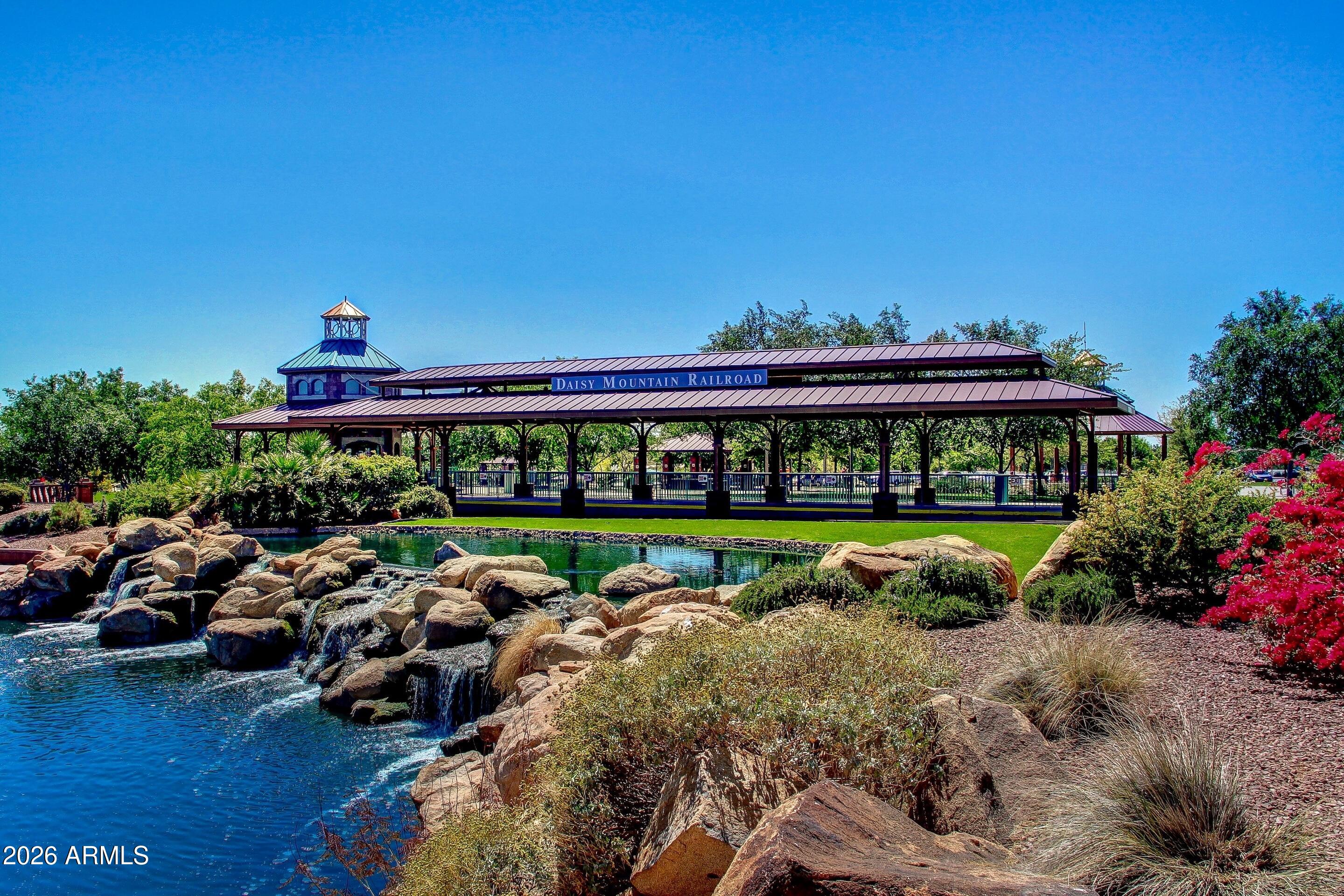 3852 West Ranier Court Anthem, AZ 85086 - Photo 55 of 58 a view of a swimming pool with lawn chairs and a potted plants